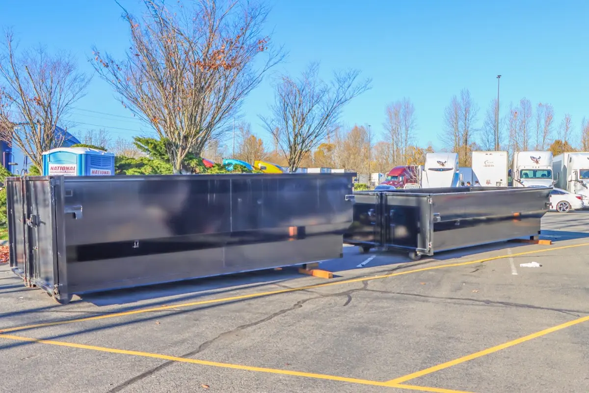 Professional dumpster rental service with roll-off container on residential driveway in Palatka